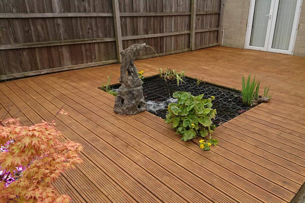 Deck and pond in Corsham by Turtle Productions