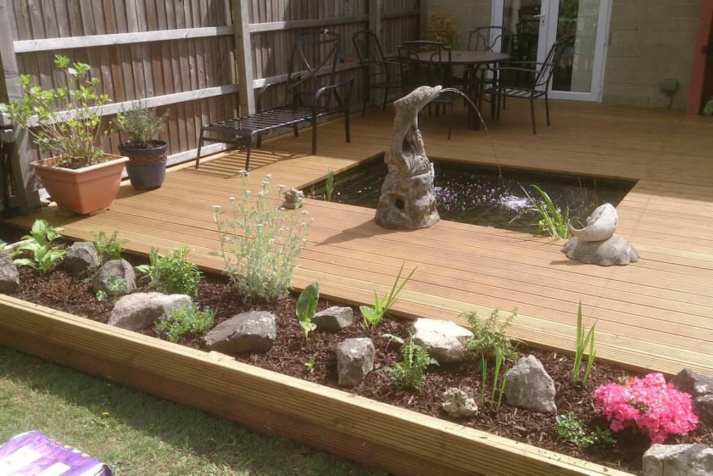 Deck and pond in Corsham by Turtle Productions