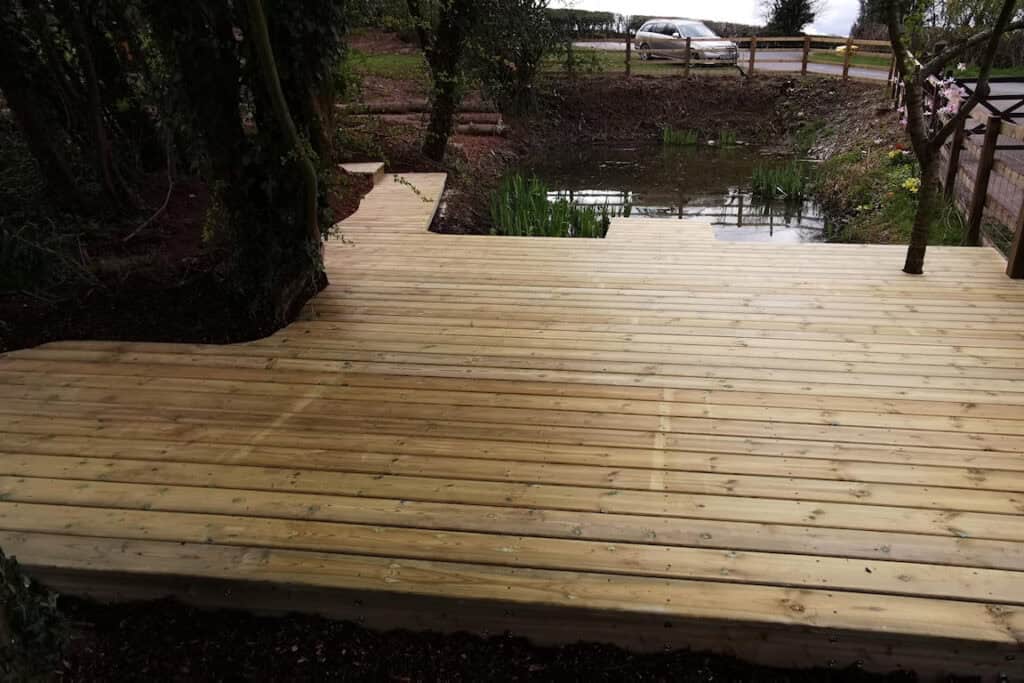 Tranquil natural pond restoration with new wildlife deck near Kington, Herefordshire, by Turtle Productions