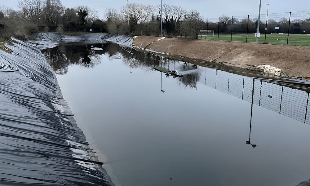 Water storage lagoon providing irrigation for football pitches